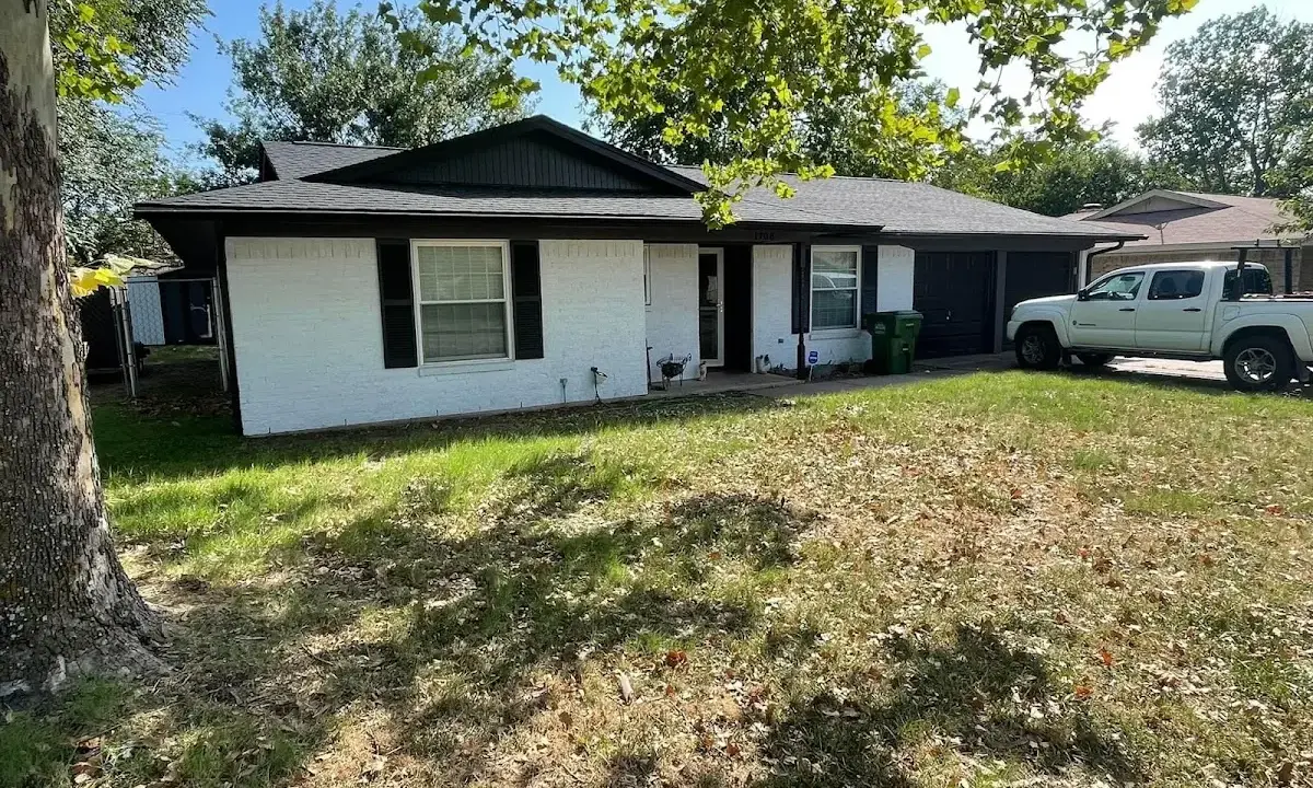Professional roofing crew working on a residential roof in Fort Wayne